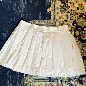 White pleated tennis skirt with mesh shorts and pocket